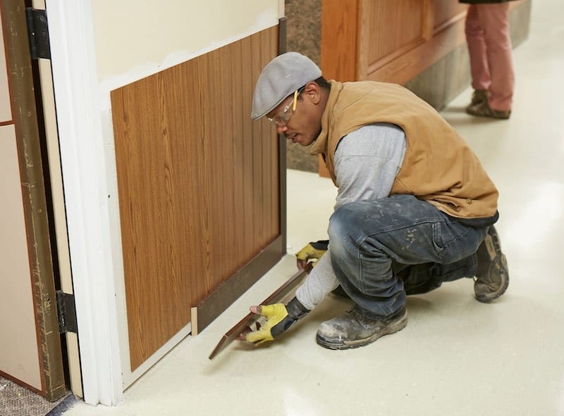 Man Installing Wall Protection